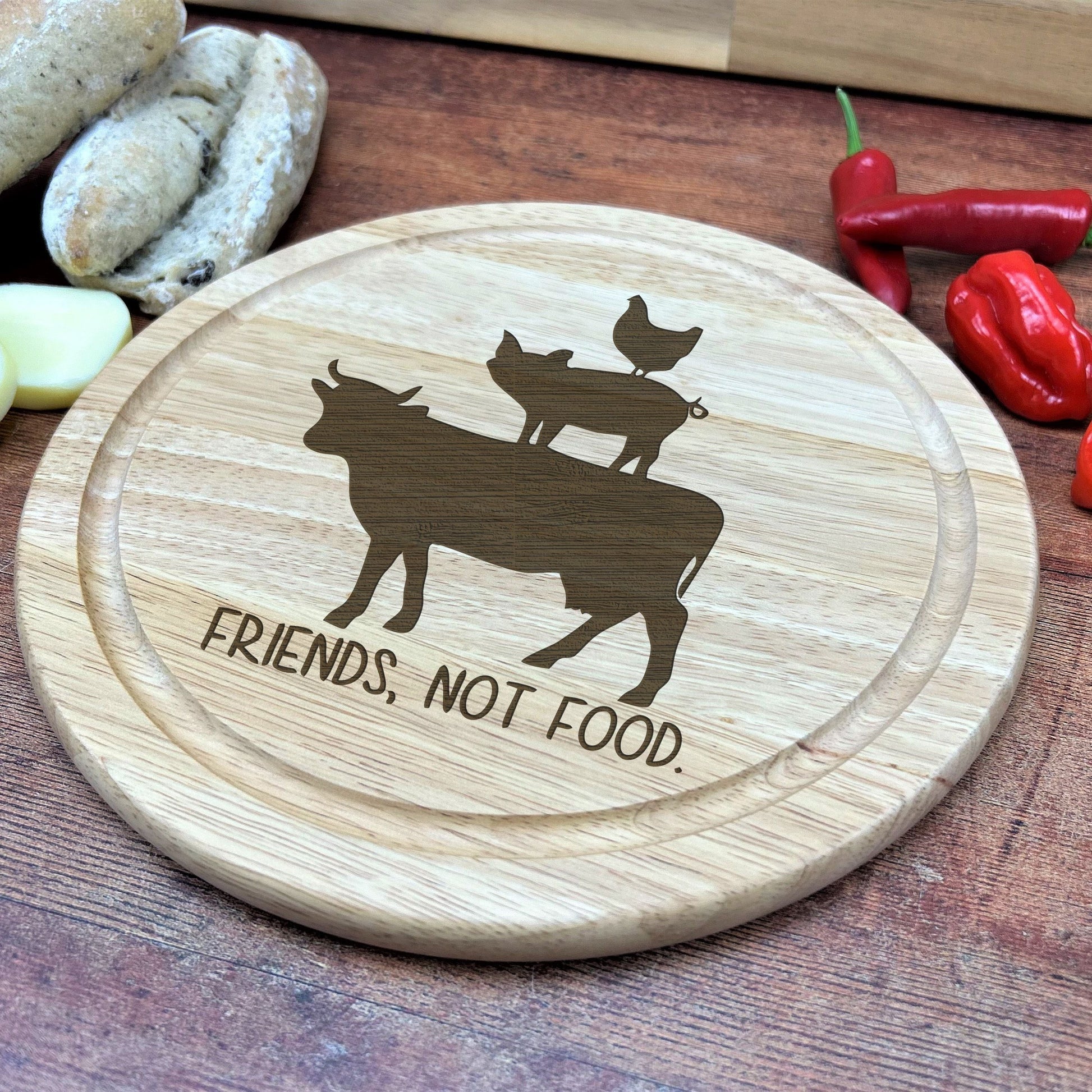 a wooden cutting board with a picture of a cow on it