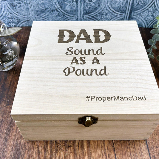 a wooden box sitting on top of a wooden table