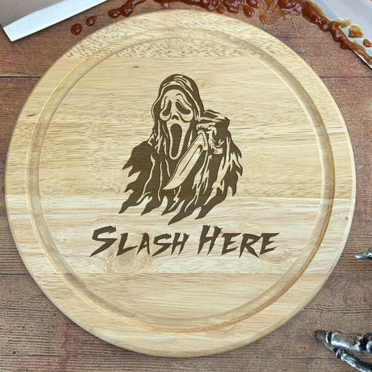 a wooden cutting board with a picture of a grime monster on it