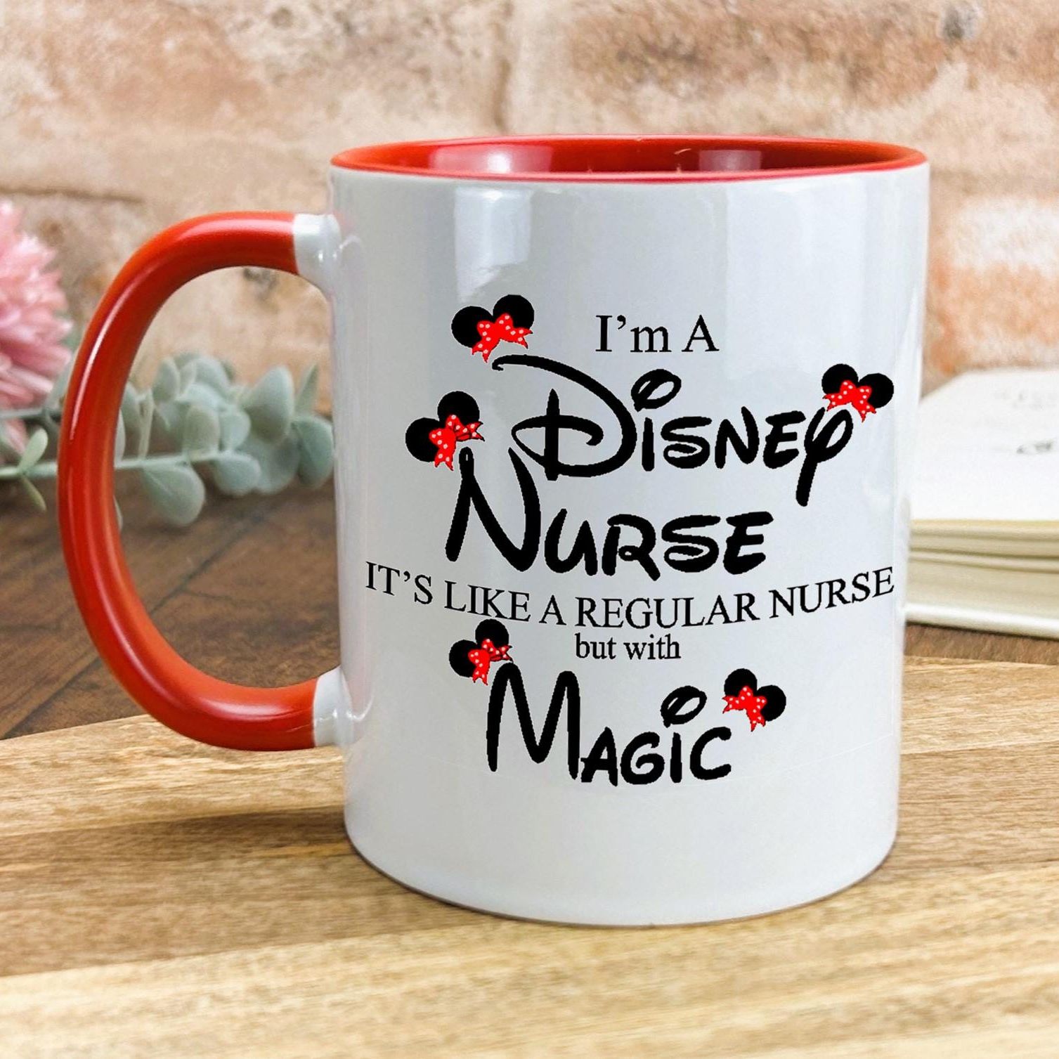 a red and white coffee mug sitting on top of a wooden table