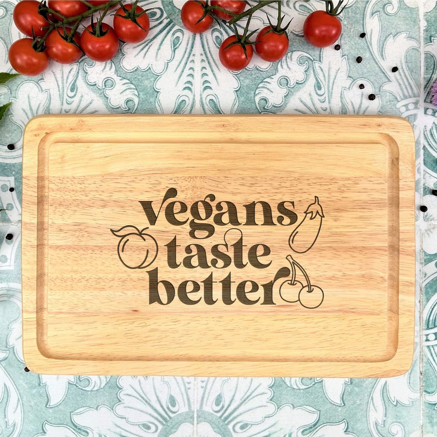 a cutting board that says vegans taste better
