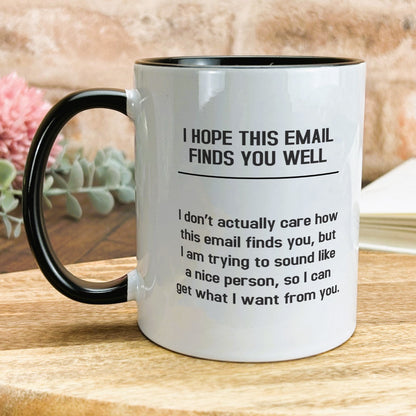 a black and white coffee mug on a wooden table