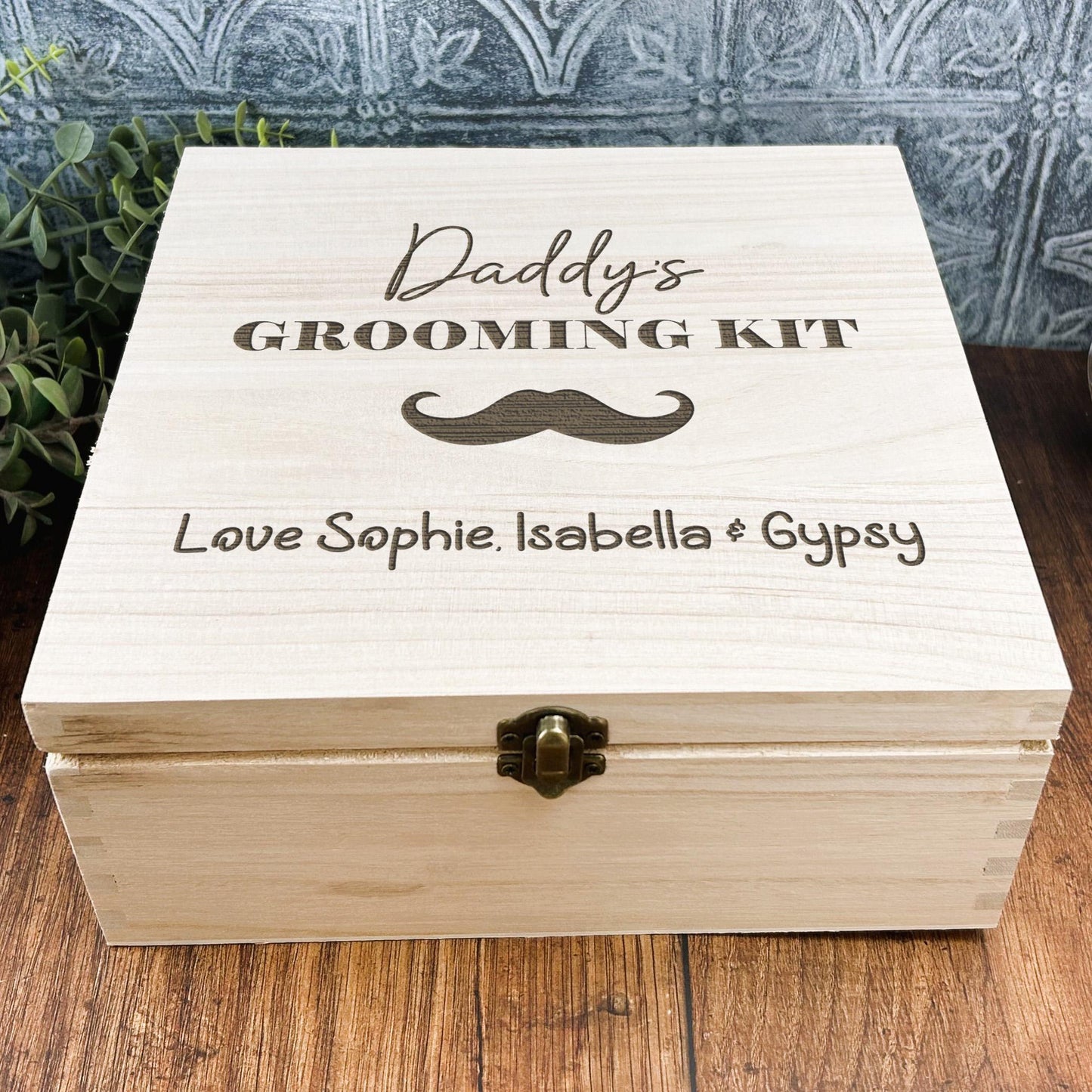 a wooden box sitting on top of a wooden table