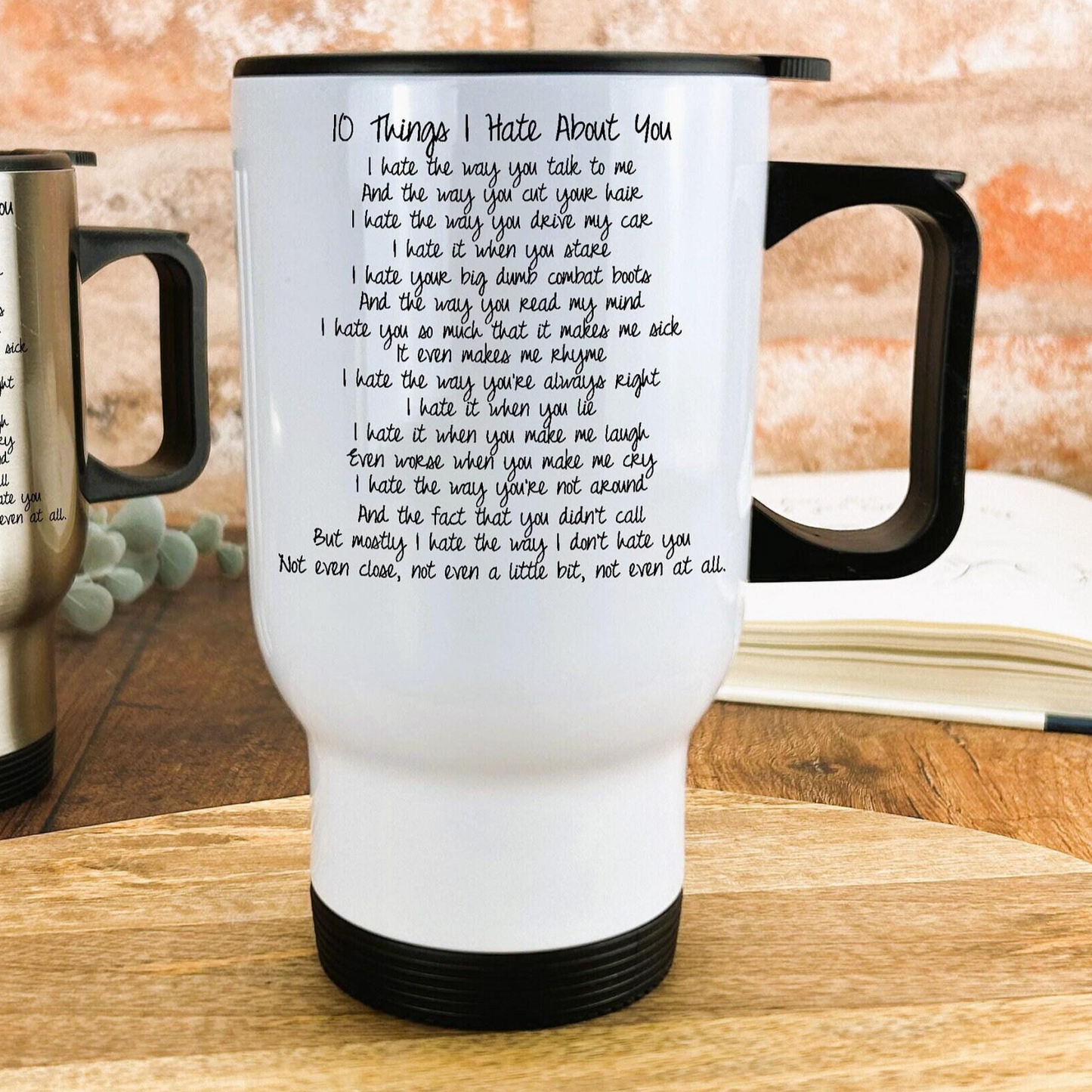 a coffee cup sitting on top of a wooden table