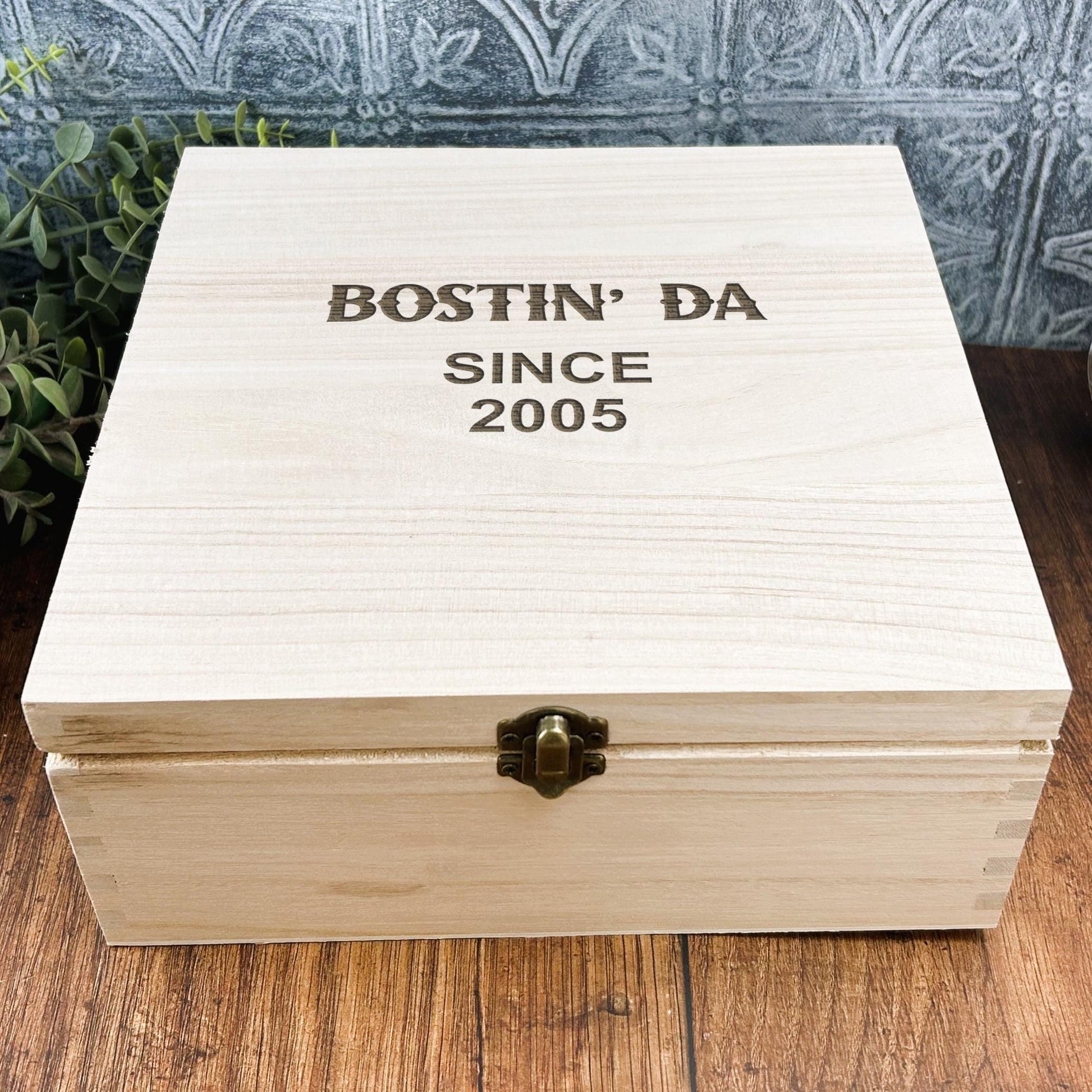 a wooden box sitting on top of a wooden table