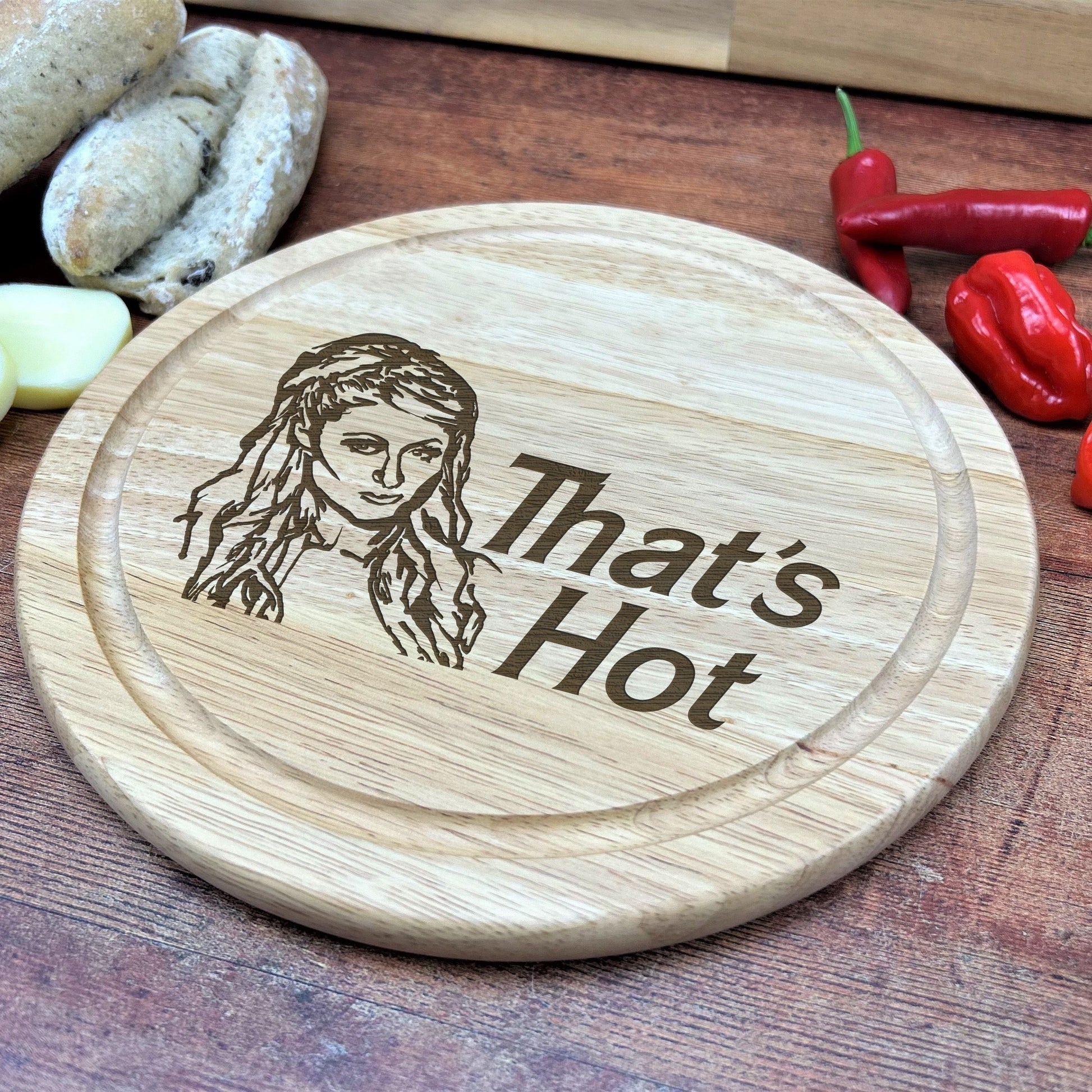 a wooden cutting board with a picture of a woman on it