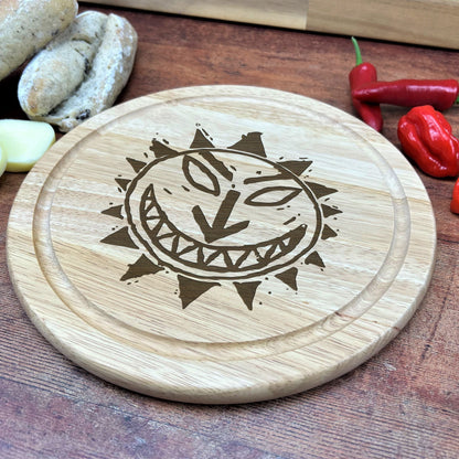 a cutting board with a picture of a smiling face on it