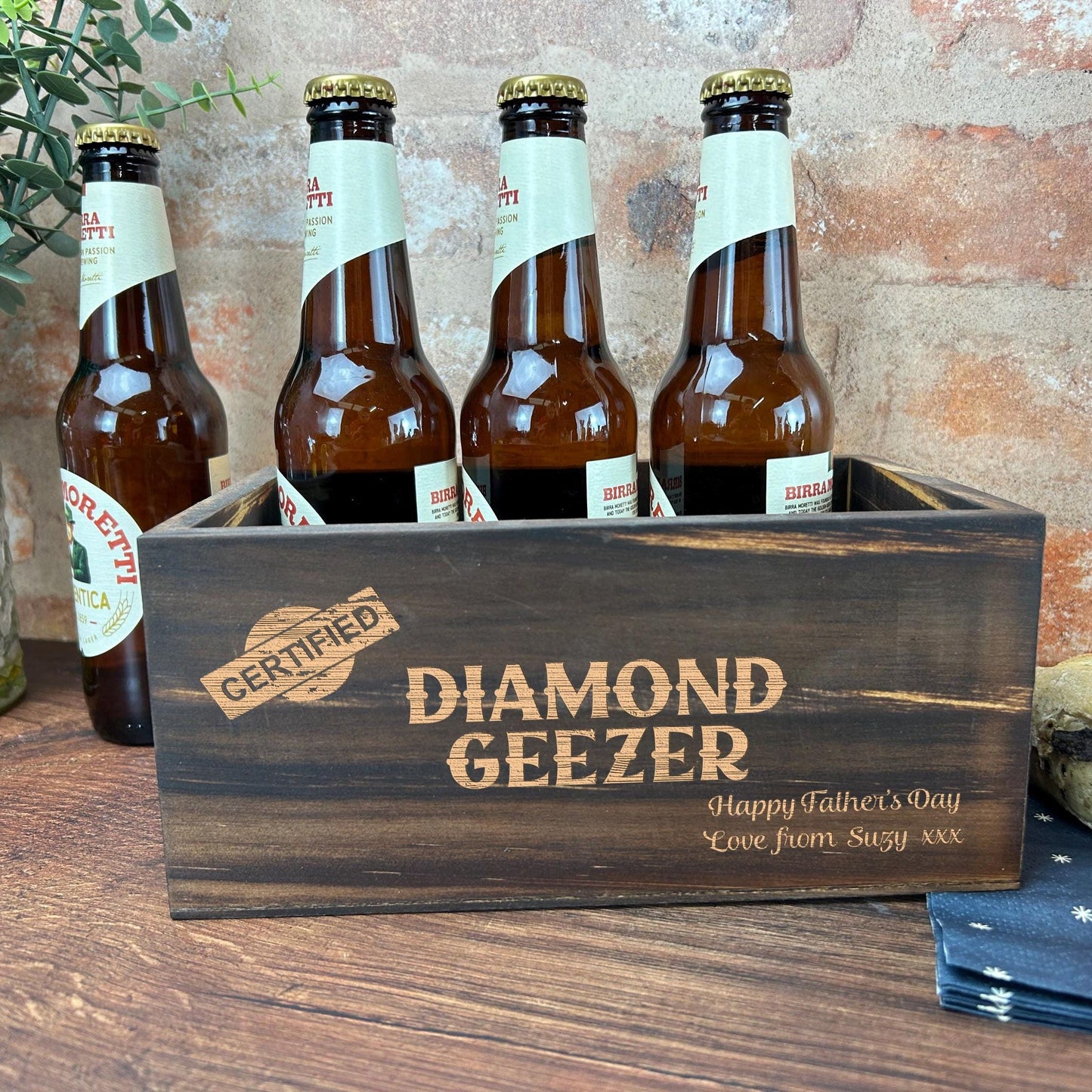 a wooden crate filled with bottles of beer