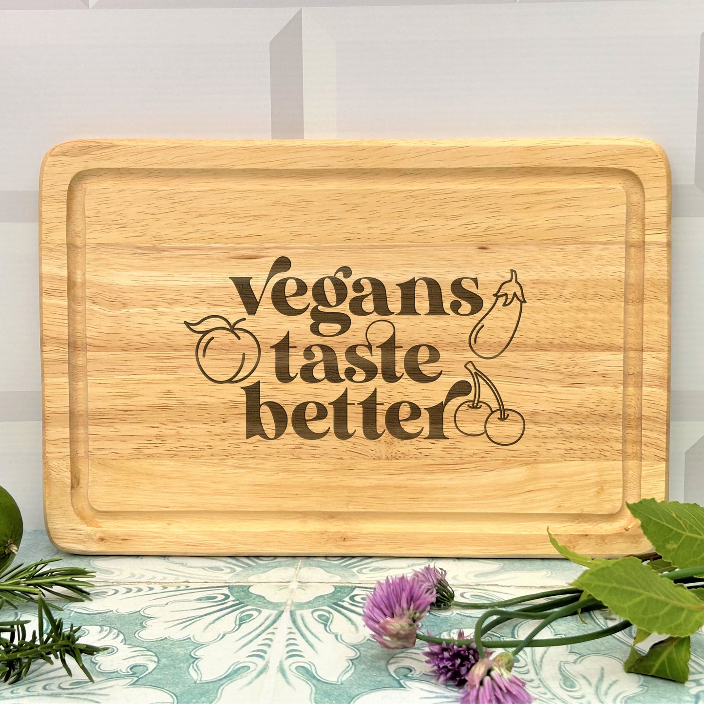 a cutting board that says vegans taste better