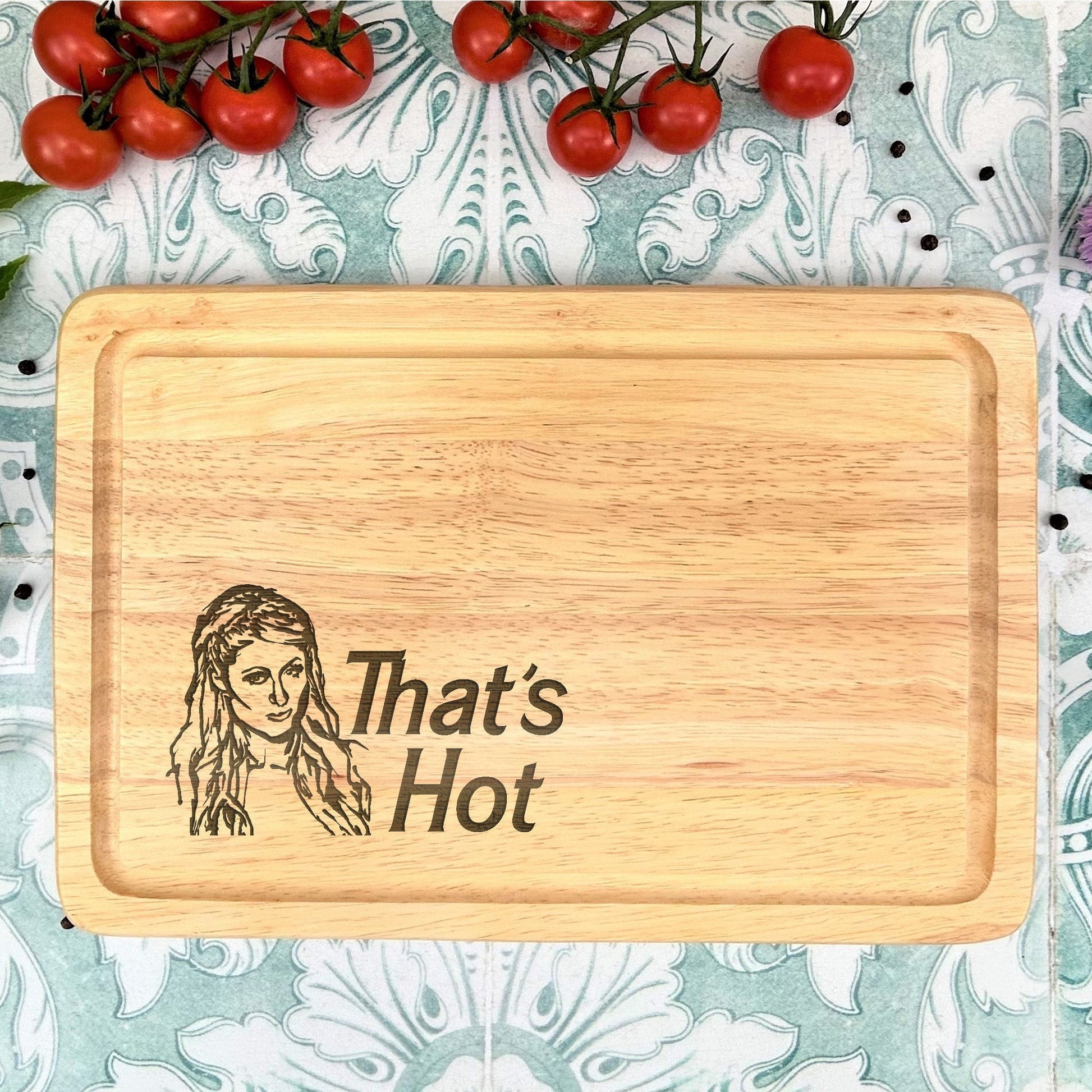 a cutting board with a picture of a woman and tomatoes