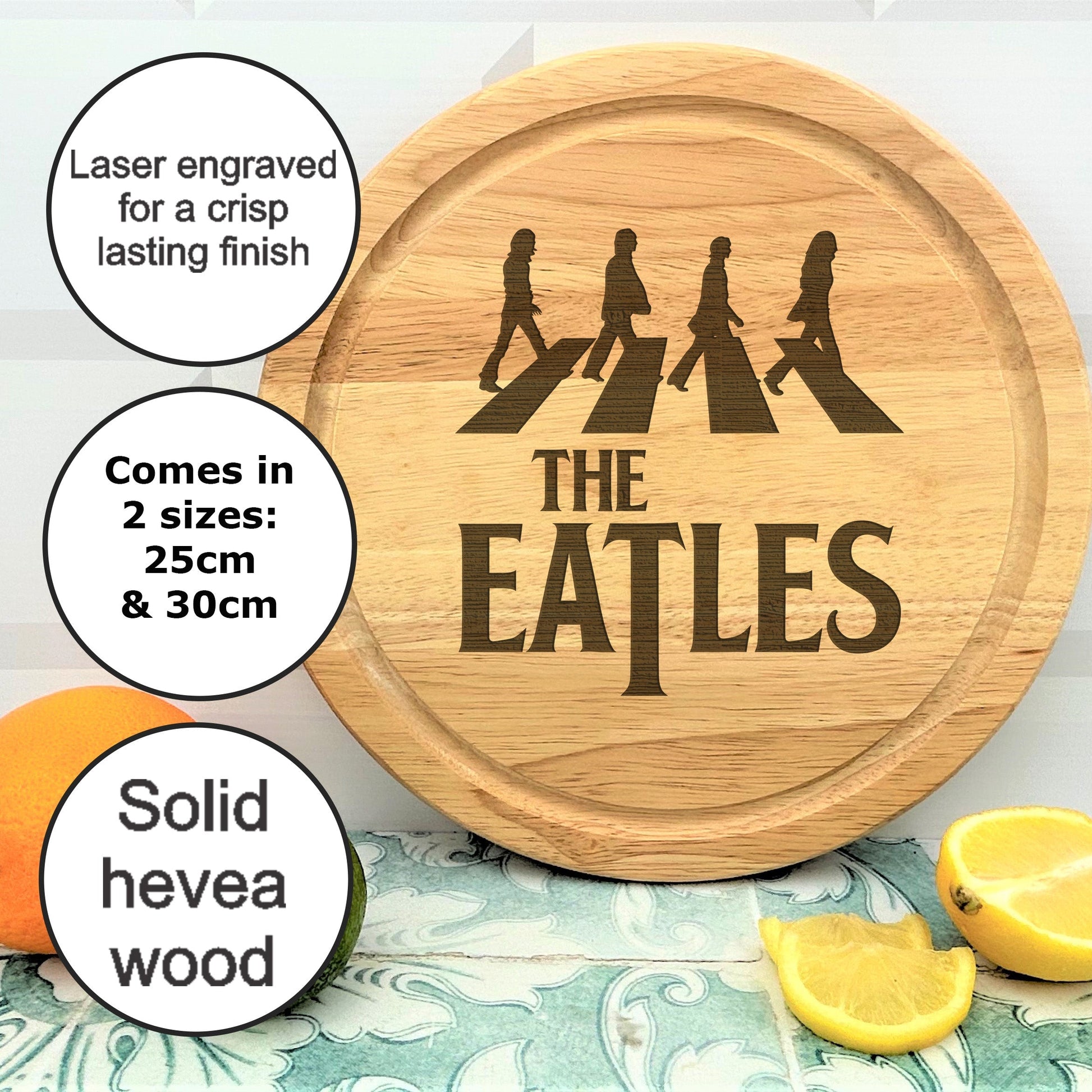 a wooden cutting board with the words the beatles on it