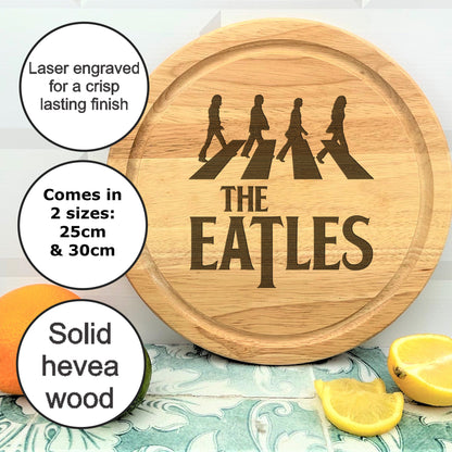a wooden cutting board with the words the beatles on it