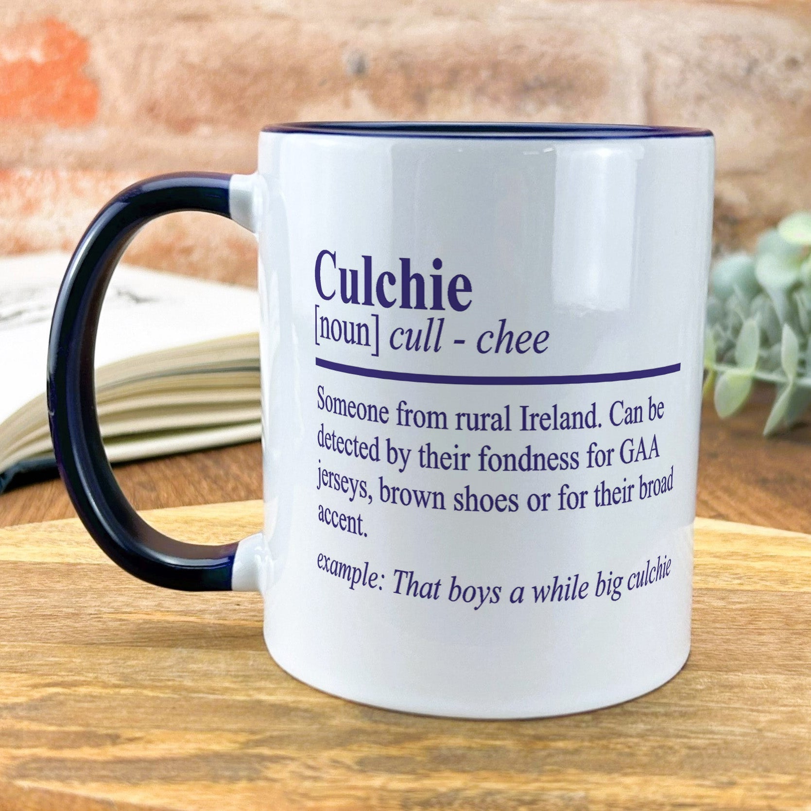 a coffee mug sitting on a wooden table