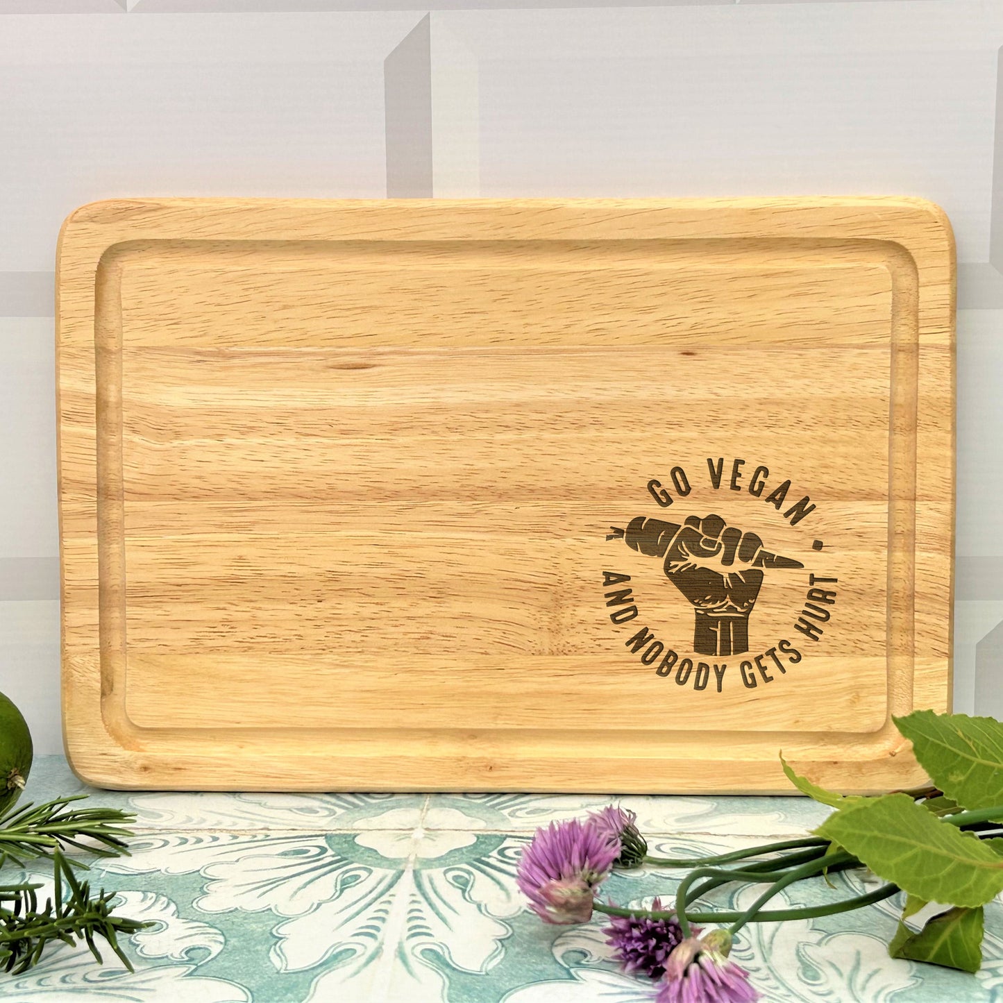 a wooden cutting board with a raised fist on it
