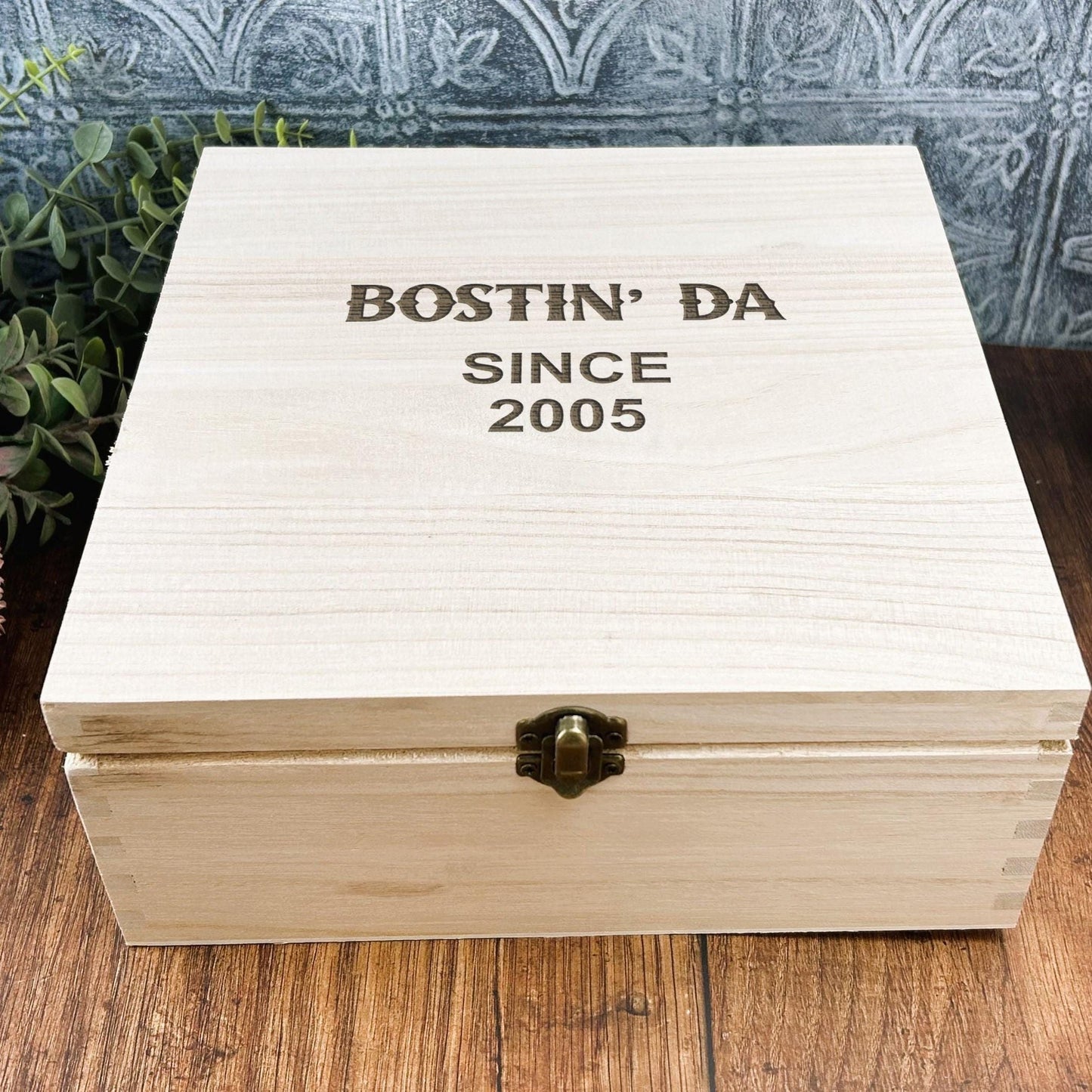 a wooden box sitting on top of a wooden table