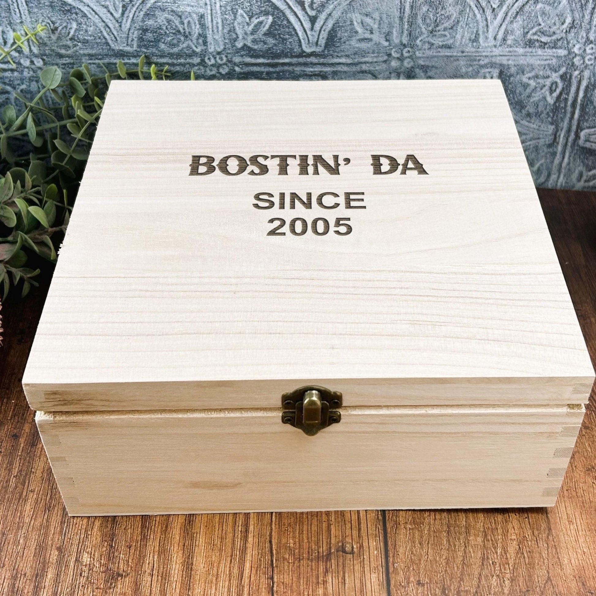 a wooden box sitting on top of a wooden table
