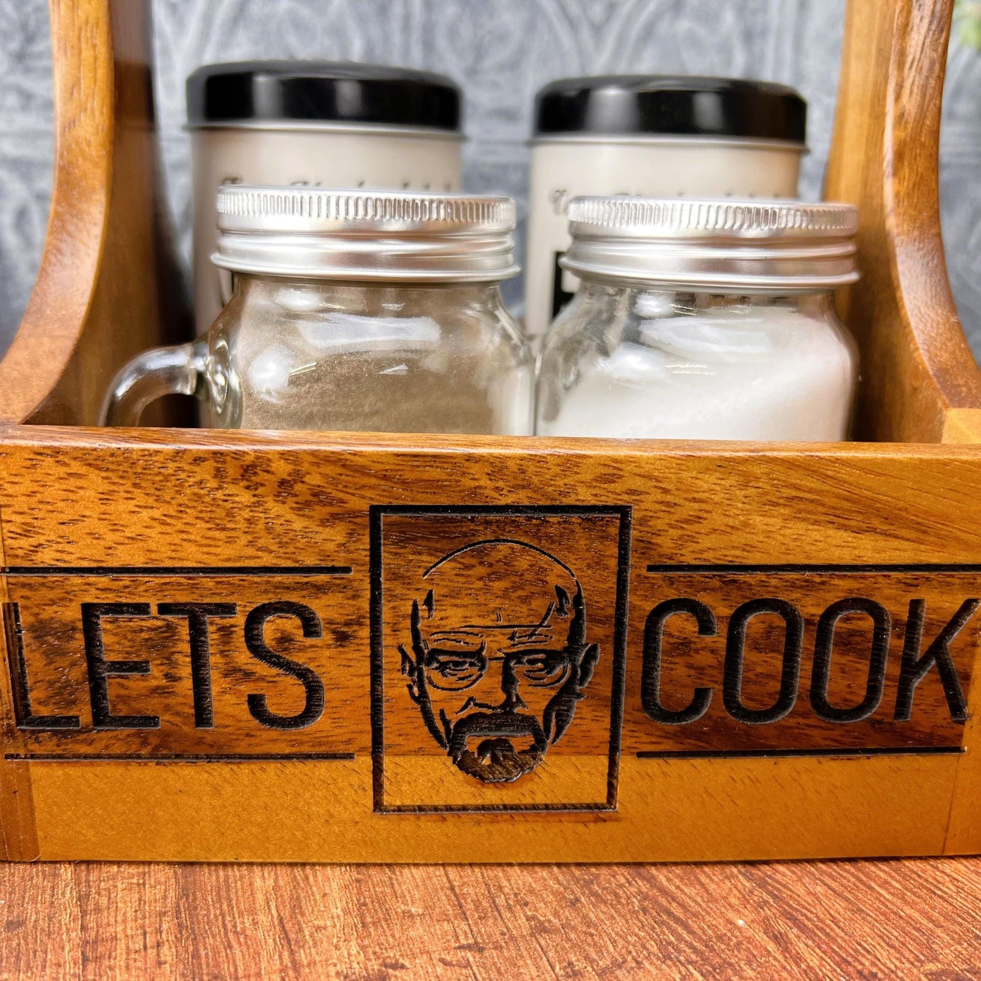 a wooden box filled with jars and salt