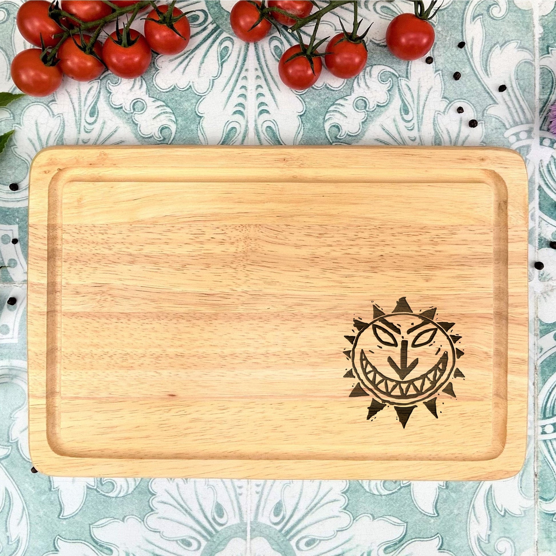 a cutting board with a picture of a smiling face on it