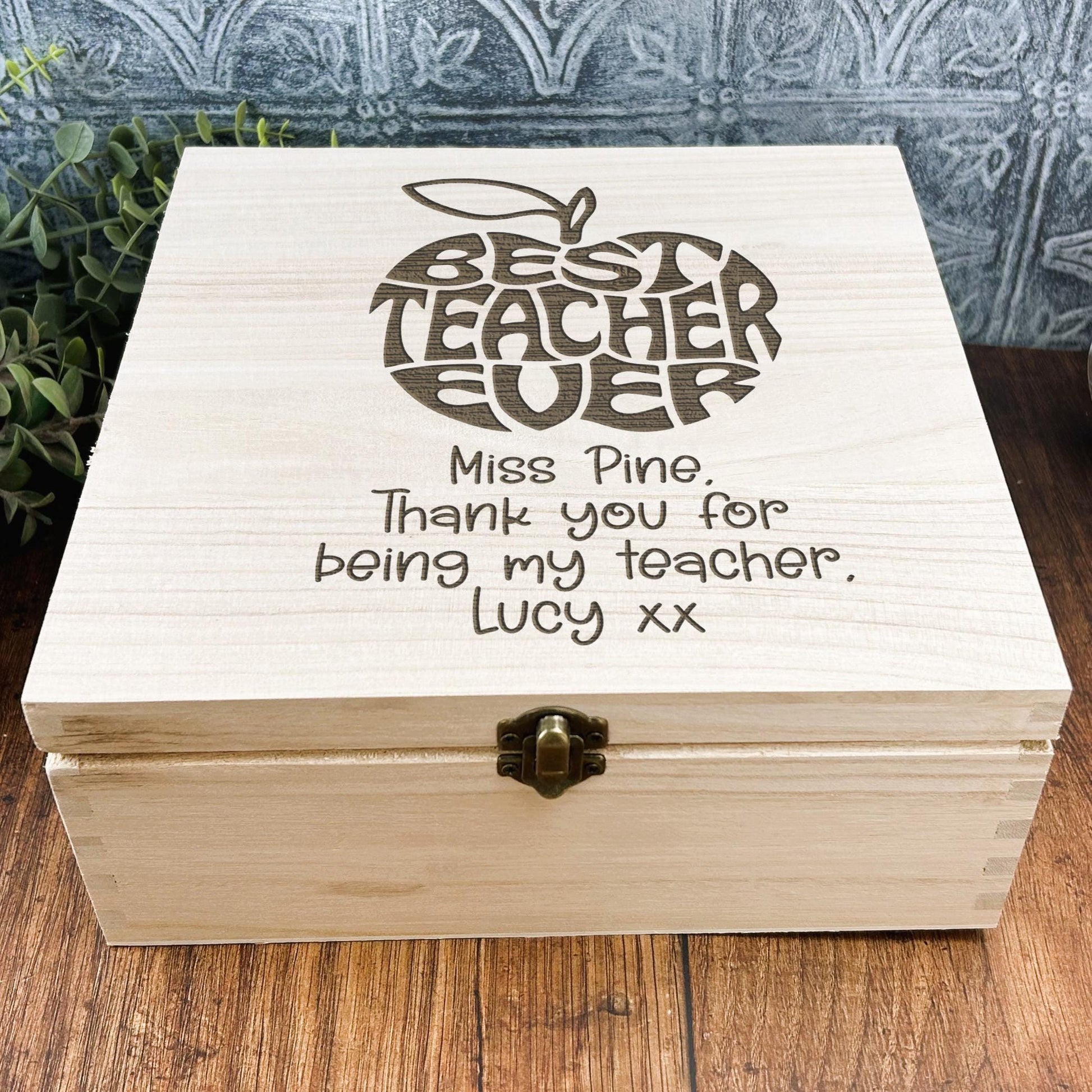 a wooden box sitting on top of a wooden table