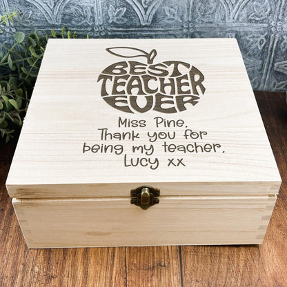 a wooden box sitting on top of a wooden table