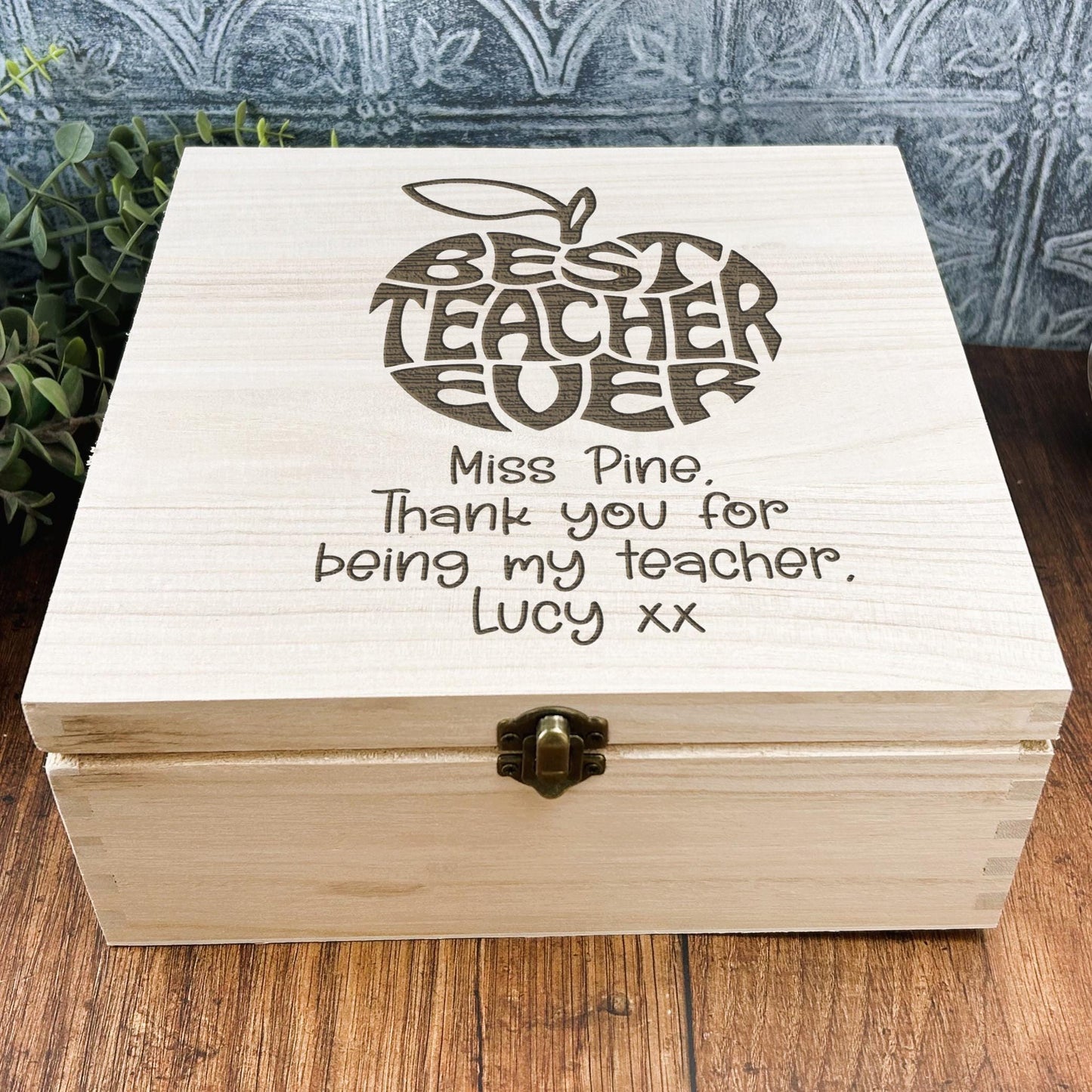 a wooden box sitting on top of a wooden table