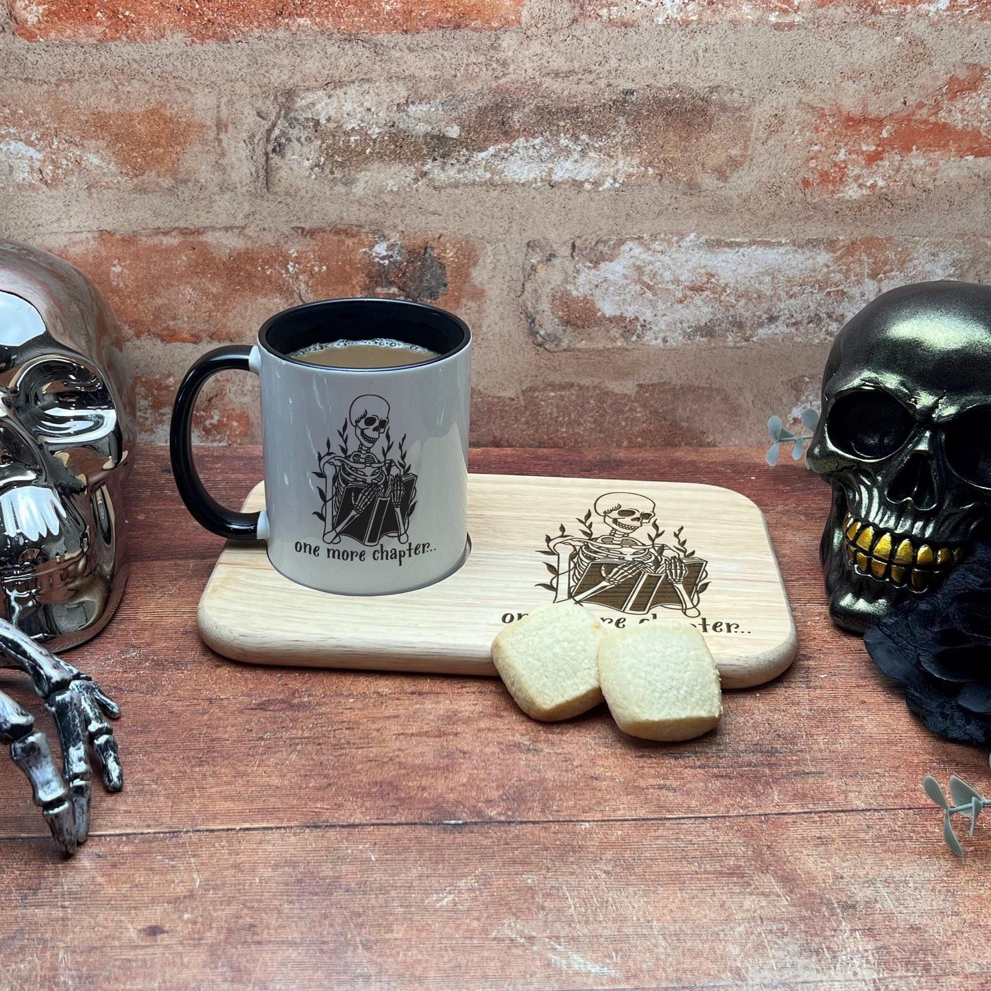 a wooden table topped with skulls and a cup of coffee