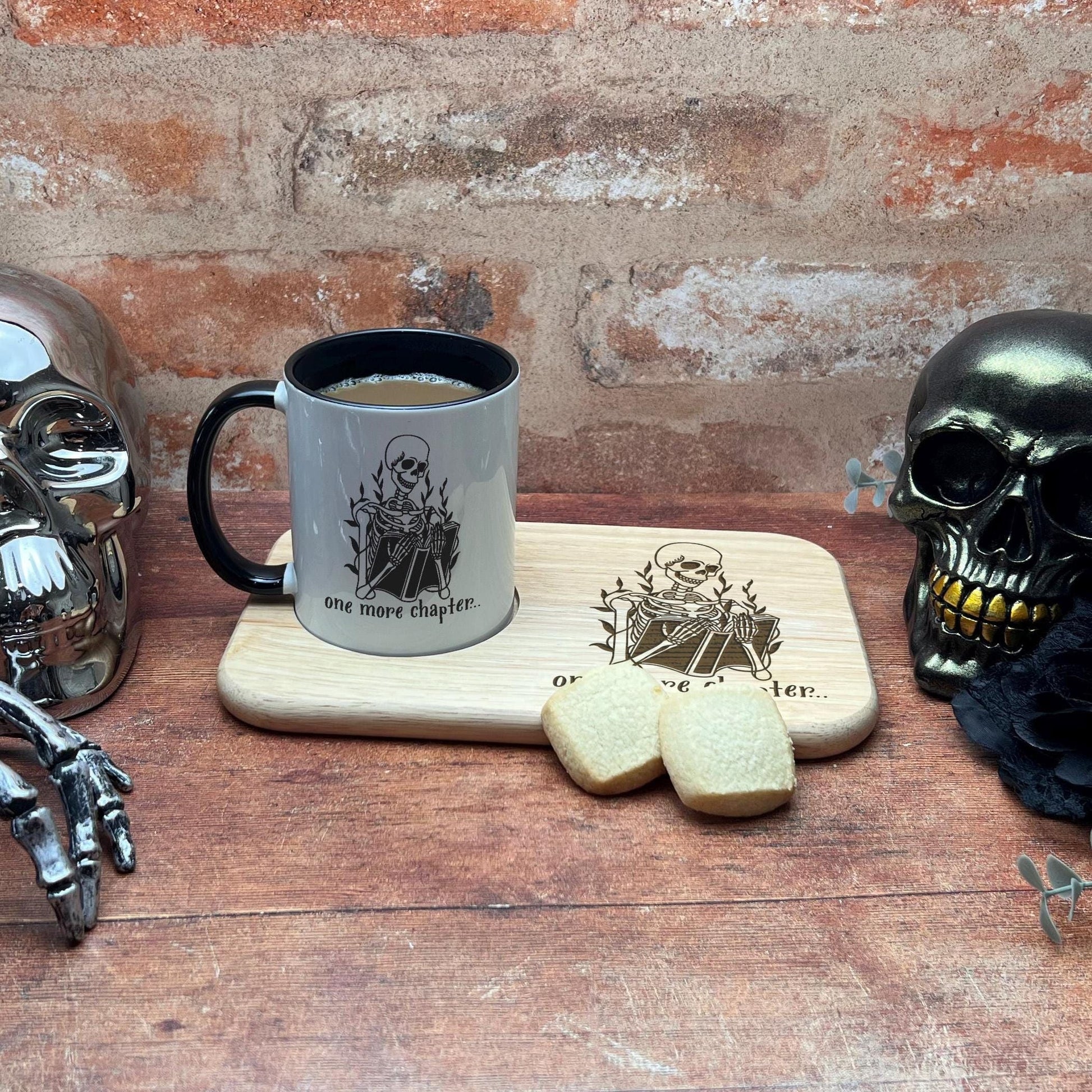 a wooden table topped with skulls and a cup of coffee