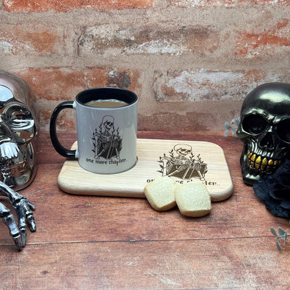 a wooden table topped with skulls and a cup of coffee