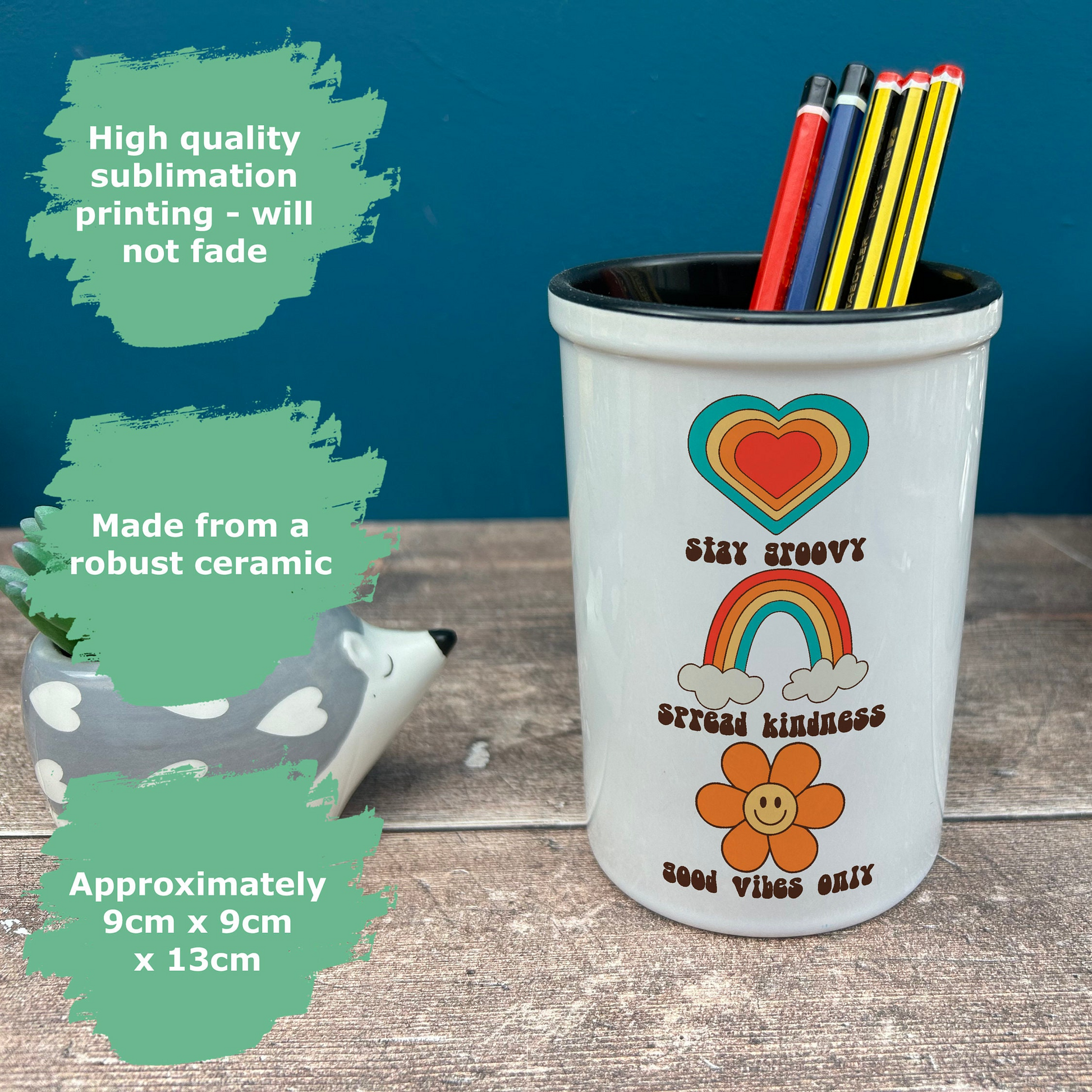 a cup with some pencils and markers in it