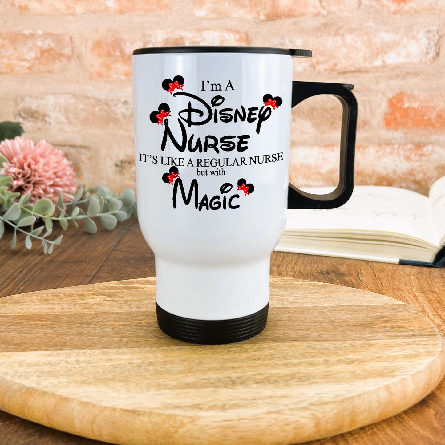 a white coffee mug sitting on top of a wooden table