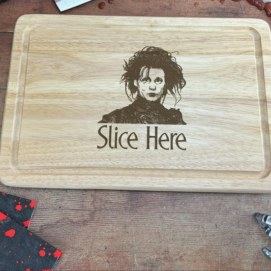 a wooden cutting board with a picture of a person on it