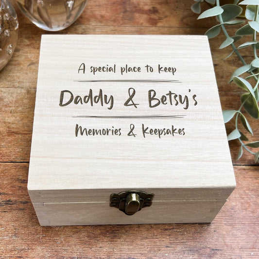 a wooden box with a ring on top of it