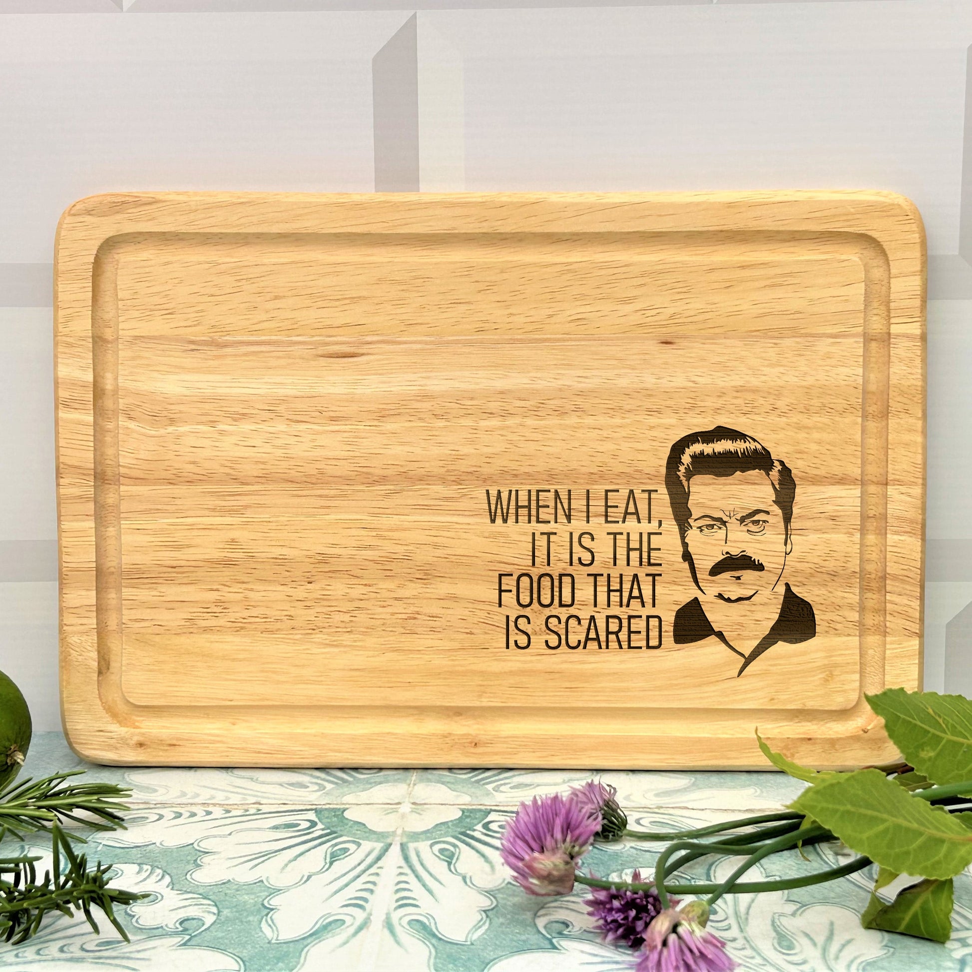 a cutting board with a picture of a man on it