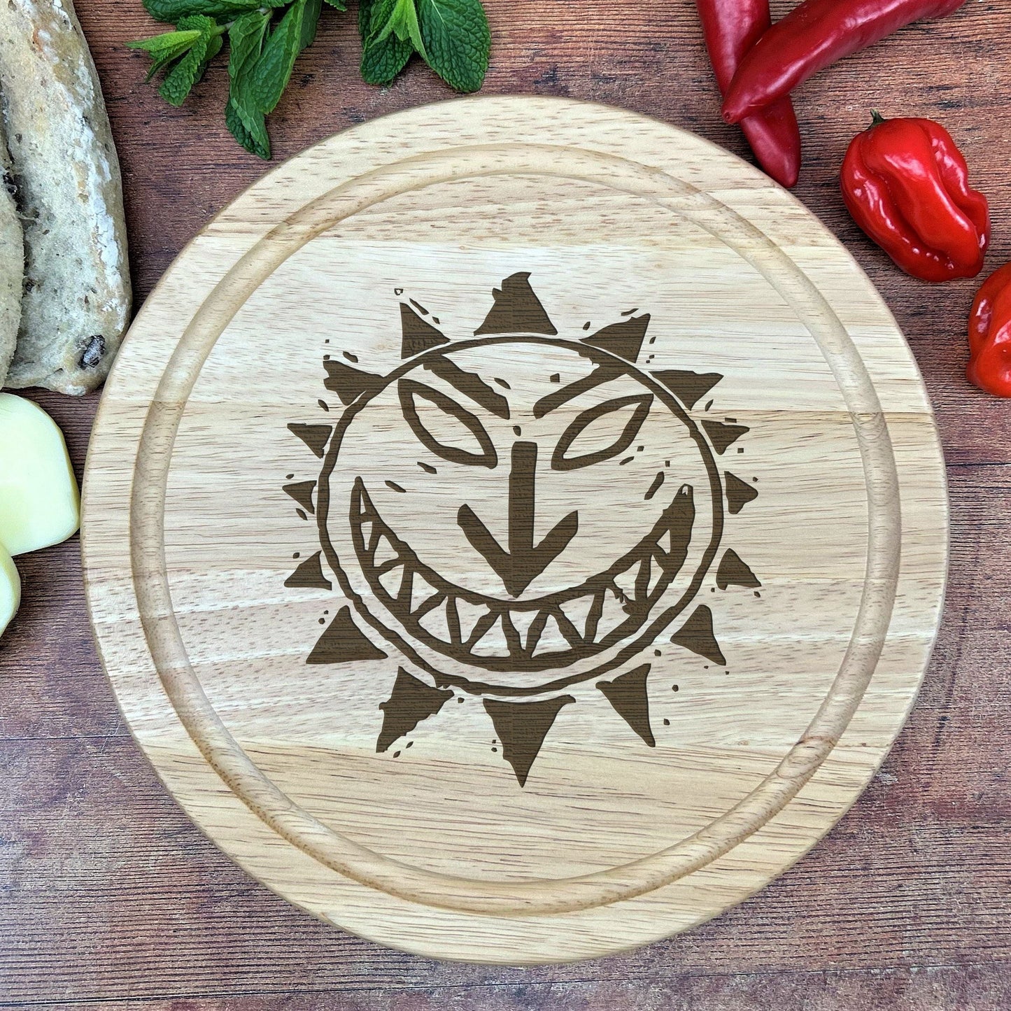 a cutting board with a picture of a smiling face on it