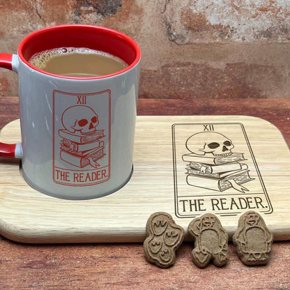 a cup of coffee sitting on top of a wooden table