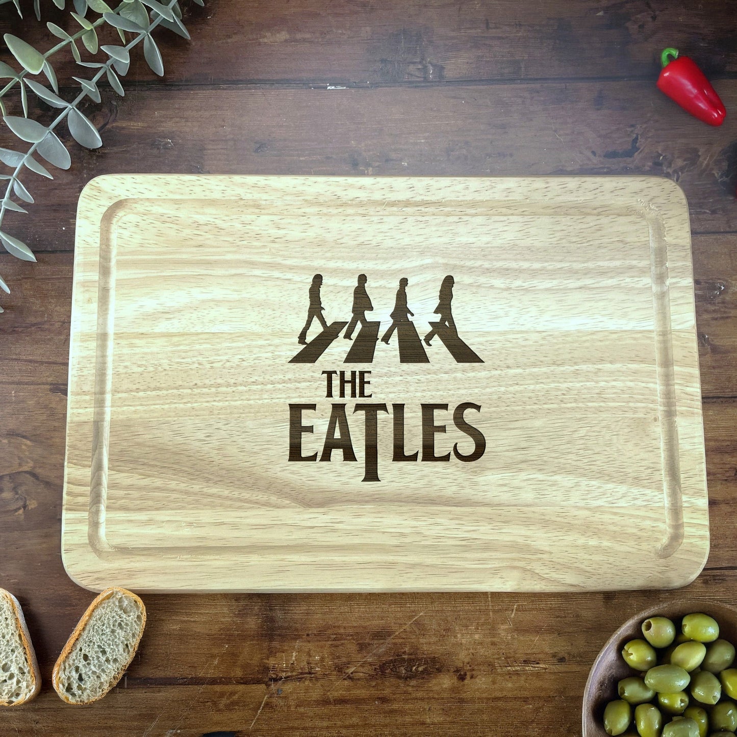 a cutting board with the words the beatles on it