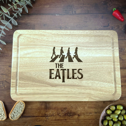a cutting board with the words the beatles on it