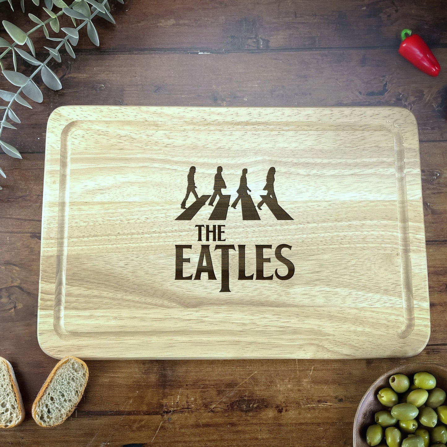 a cutting board with the words the beatles on it