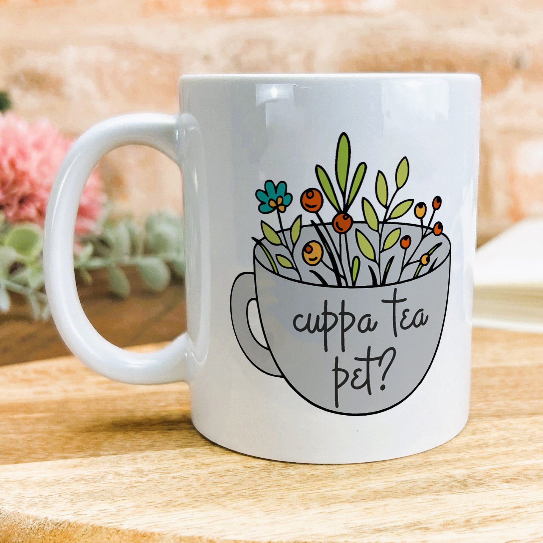 a white coffee mug with a picture of flowers in it