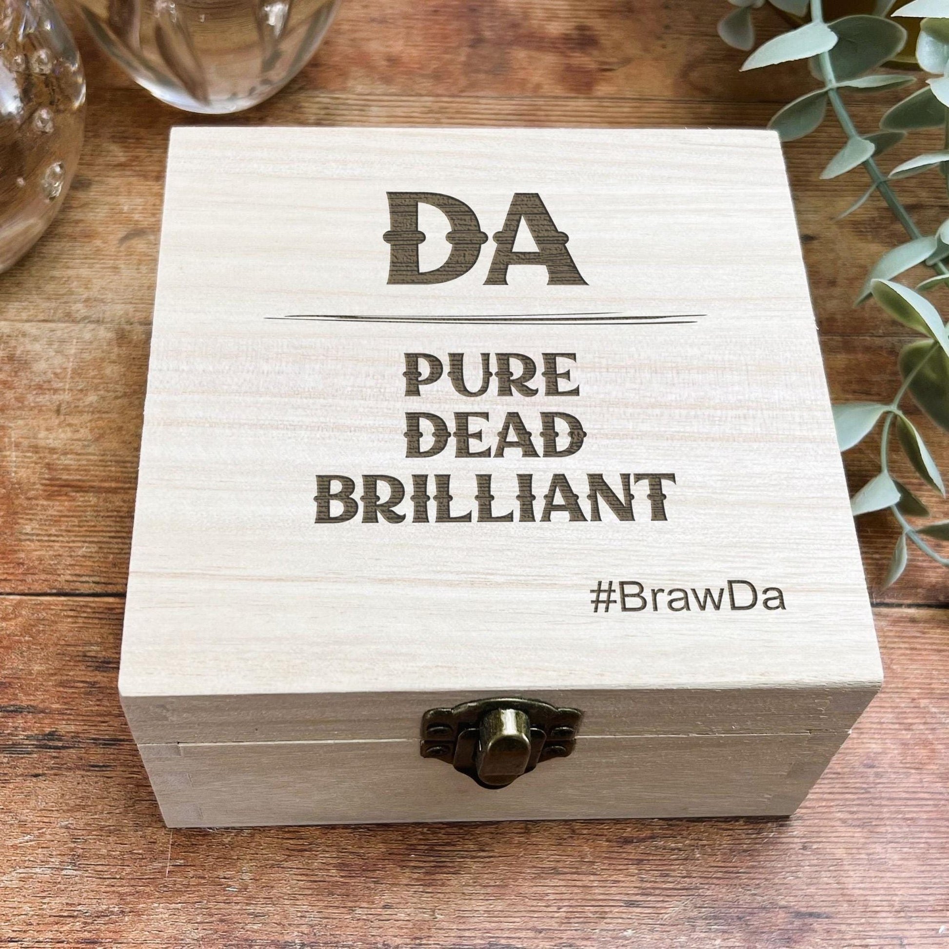 a wooden box sitting on top of a wooden table