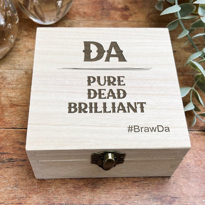 a wooden box sitting on top of a wooden table