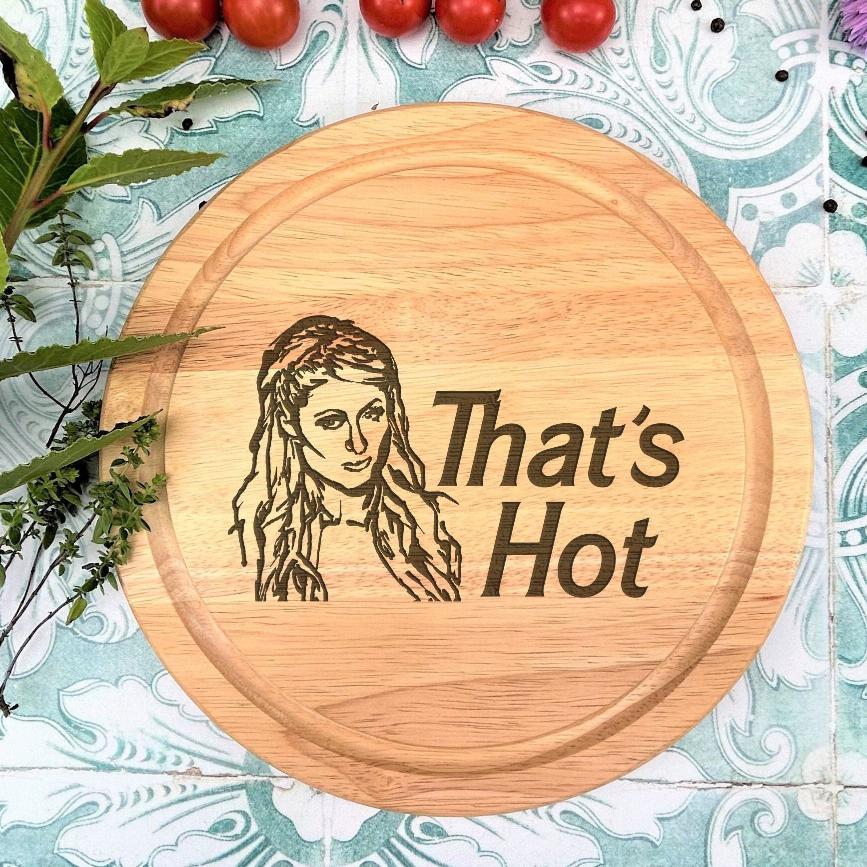 a wooden sign that says, that's hot with a picture of a woman