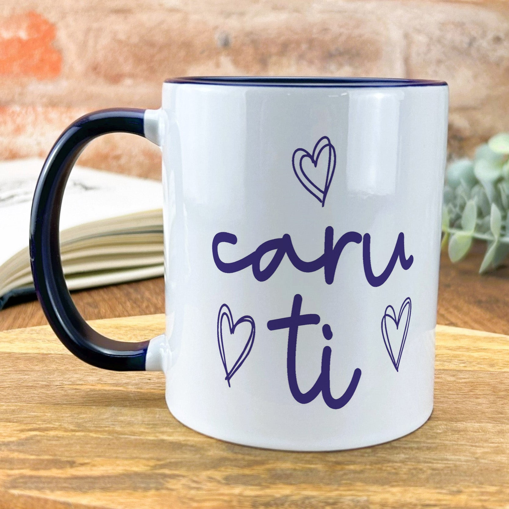 a black and white coffee mug with the words caru ti on it