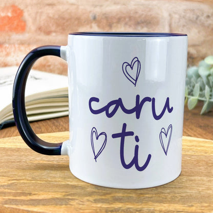 a black and white coffee mug with the words caru ti on it