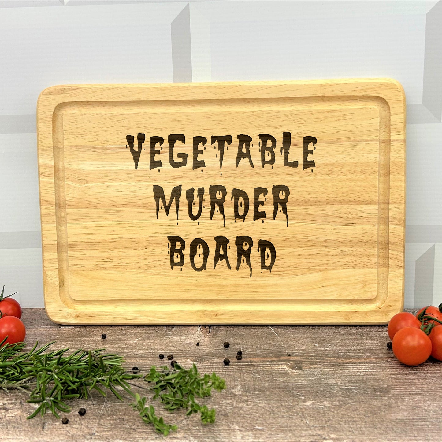 a cutting board with the words vegetable murder board on it