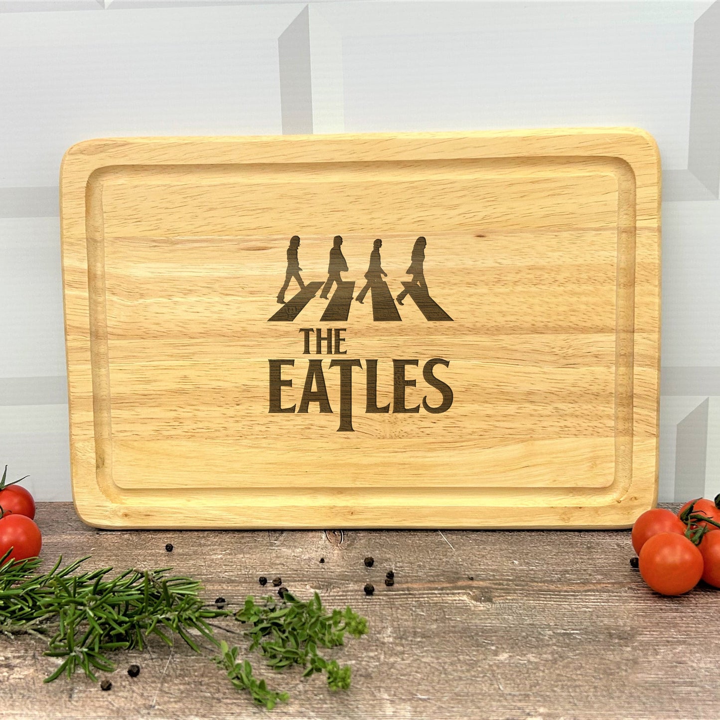 a cutting board with the beatles on it