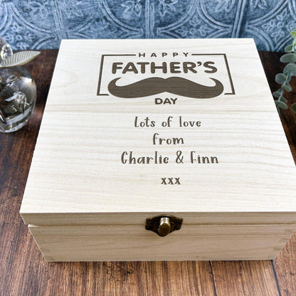 a wooden box with a picture of a mustache on it