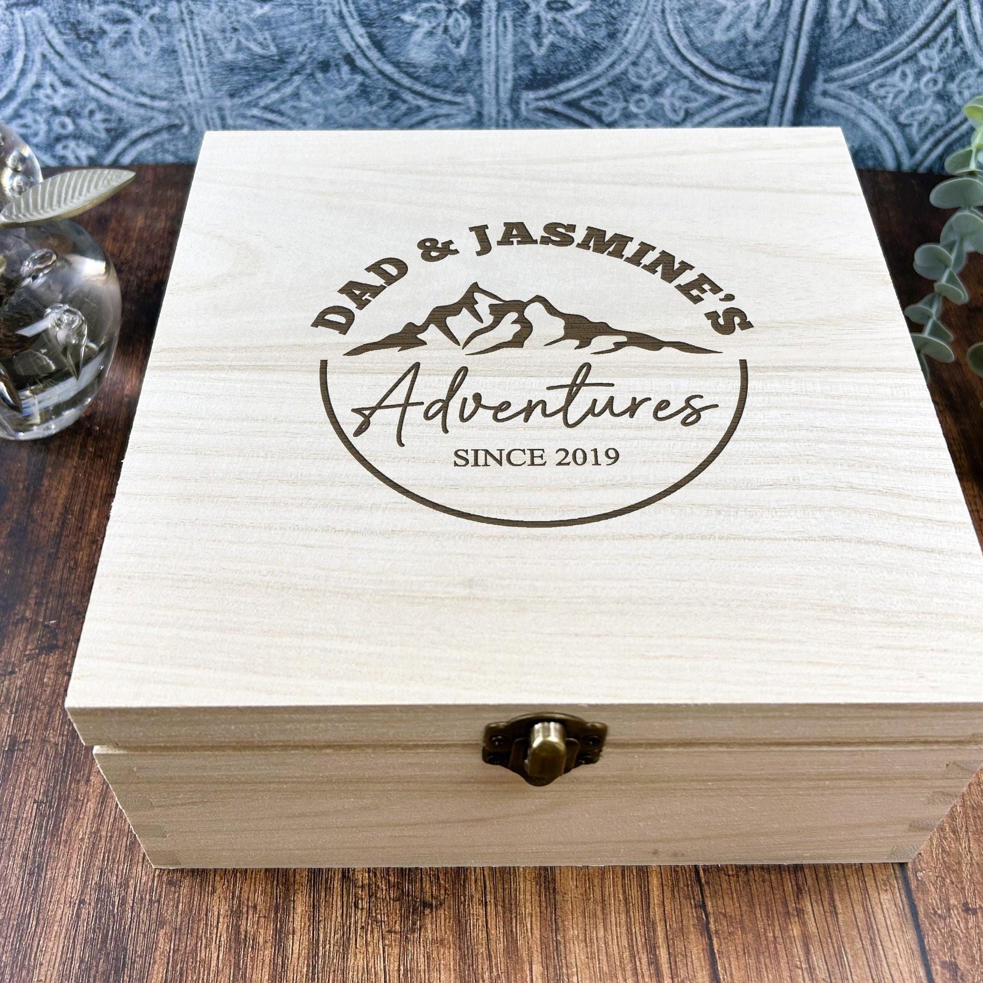 a wooden box sitting on top of a wooden table