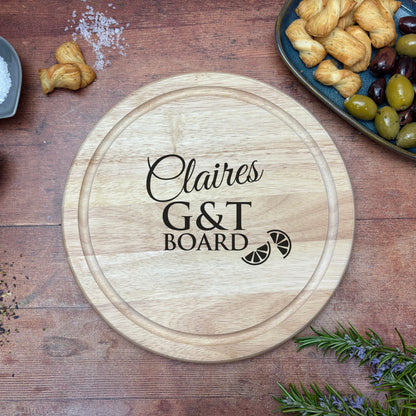 a wooden cutting board with the words g & t board on it