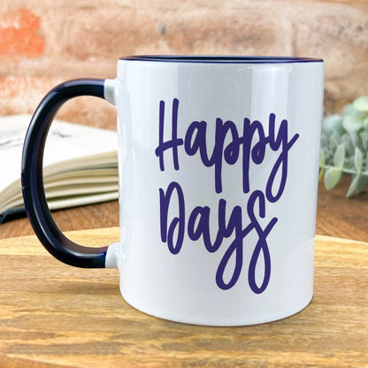 a black and white coffee mug with the words happy days on it